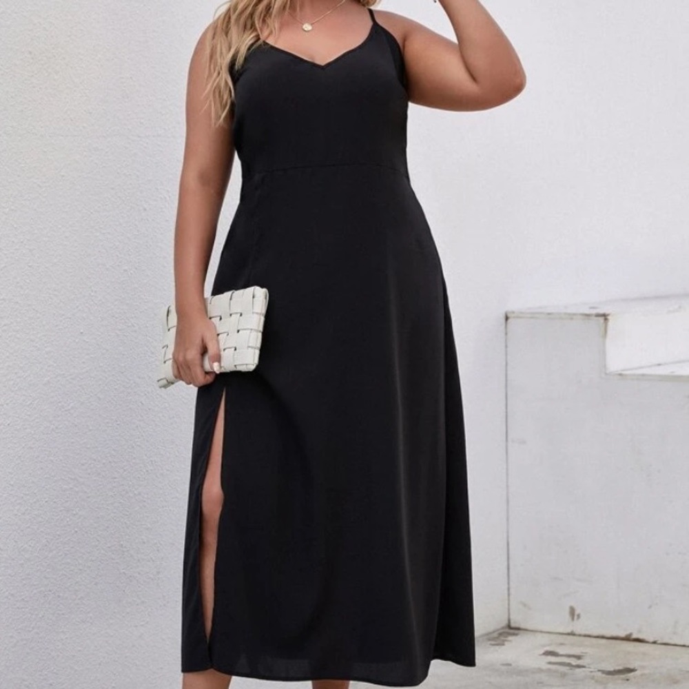 NEVER WORN black dress with adjustable straps,slit in leg, in original packaging